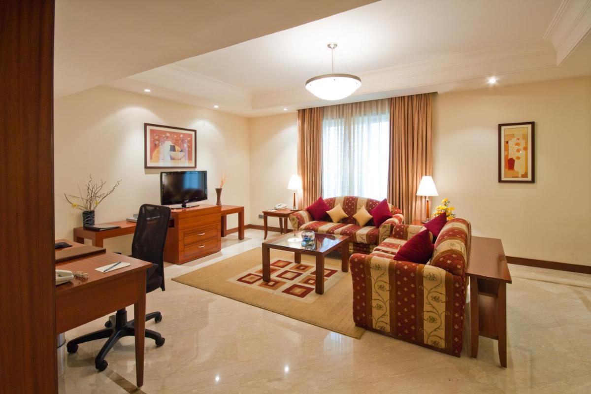 a living room with a couch and a table at The Accord Metropolitan in Chennai