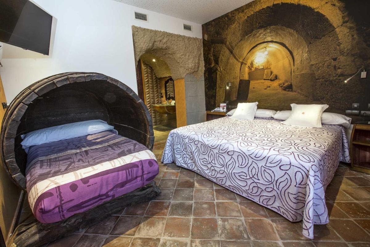 Cama o camas de una habitación en Hotel SPA El Lagar de Isilla
