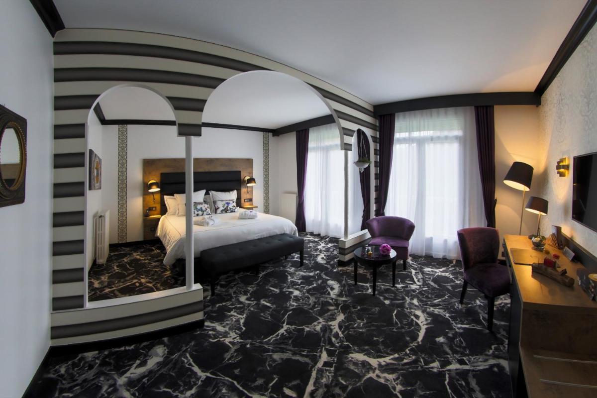 Un ou plusieurs lits dans un hébergement de l'établissement Hôtel du Barry Resort & Spa