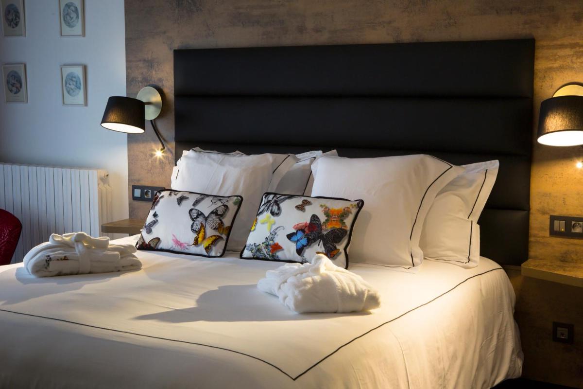 Un ou plusieurs lits dans un hébergement de l'établissement Hôtel du Barry Resort & Spa