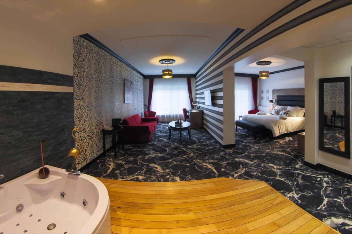 Un ou plusieurs lits dans un hébergement de l'établissement Hôtel du Barry Resort & Spa
