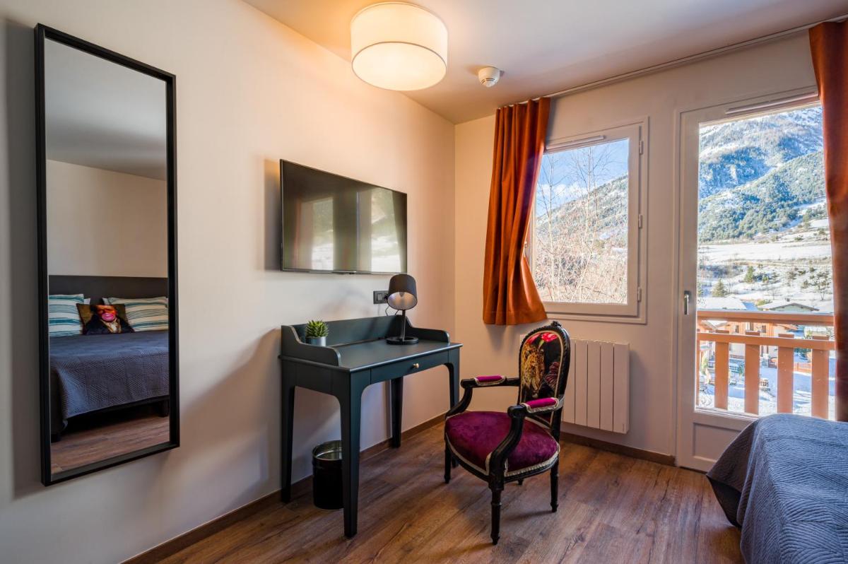 Un ou plusieurs lits dans un hébergement de l'établissement L'Outa Hotel Restaurant