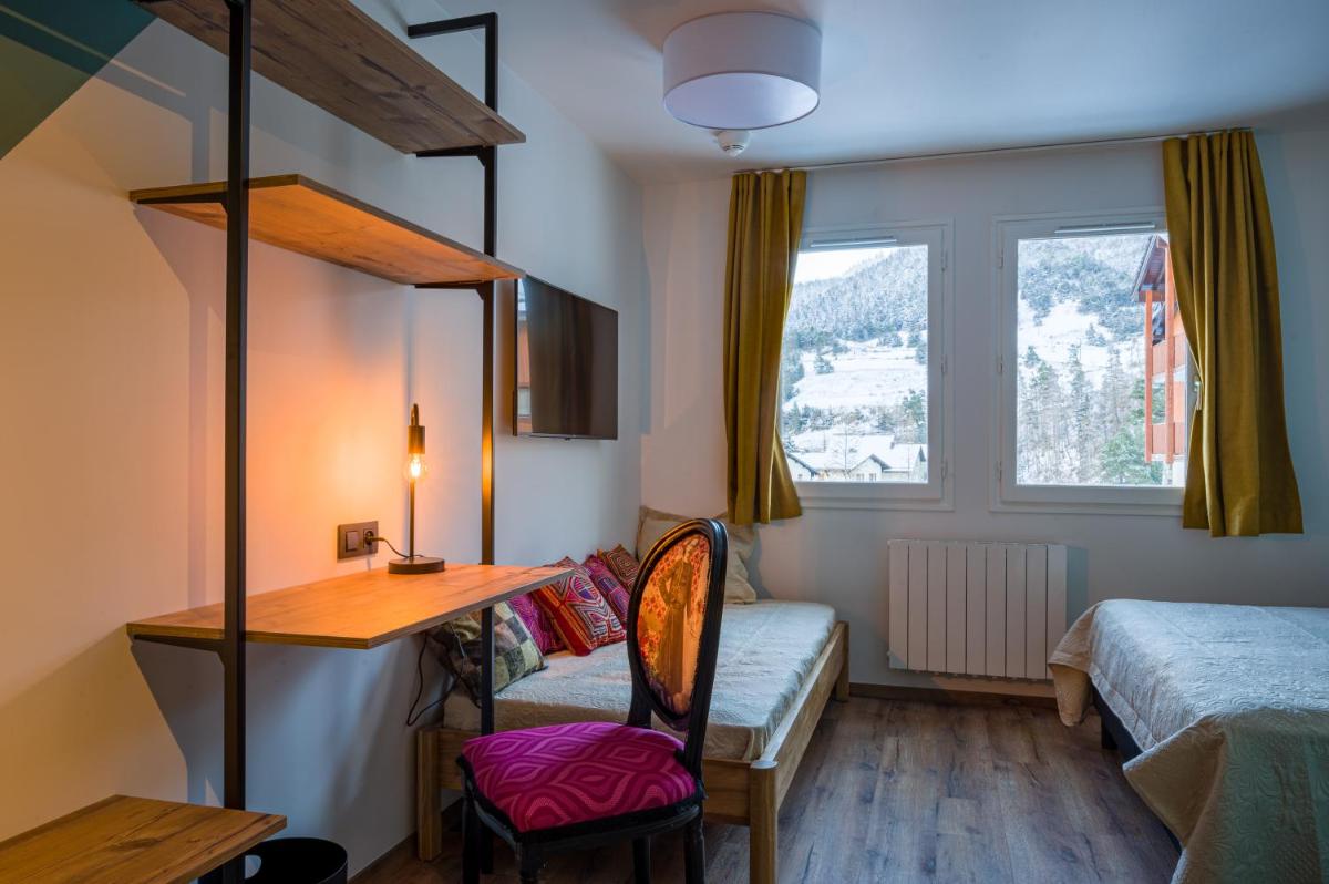 Un ou plusieurs lits dans un hébergement de l'établissement L'Outa Hotel Restaurant