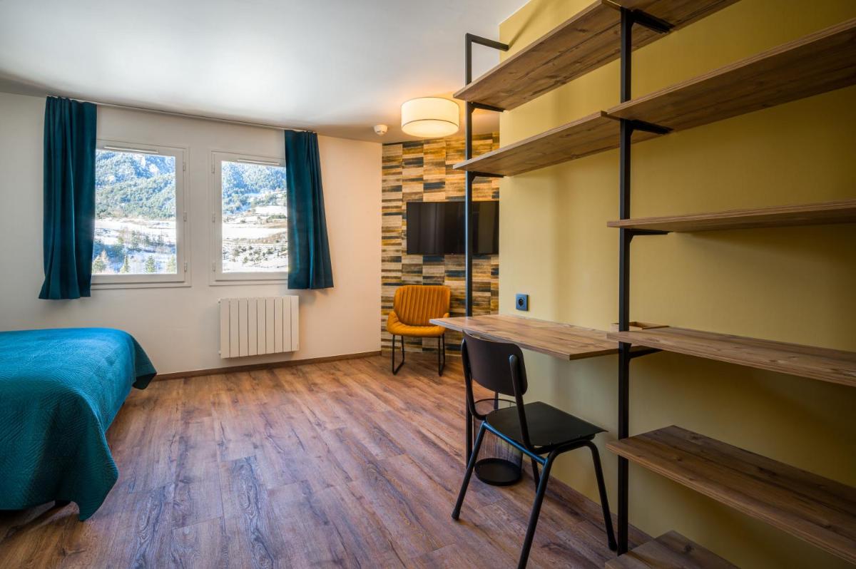 Un ou plusieurs lits dans un hébergement de l'établissement L'Outa Hotel Restaurant