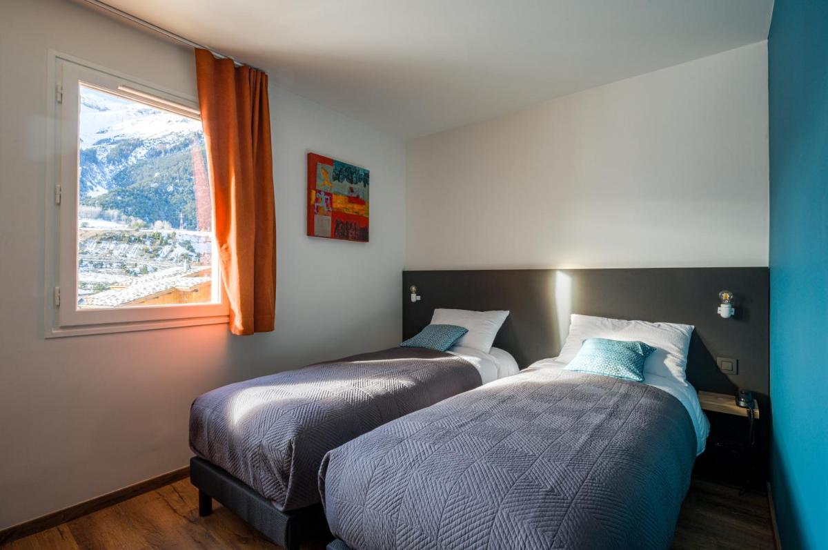 Un ou plusieurs lits dans un hébergement de l'établissement L'Outa Hotel Restaurant