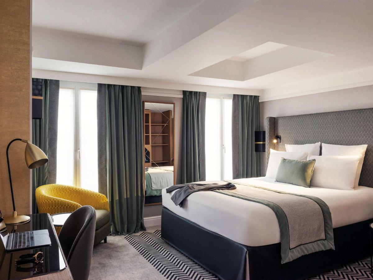 Un ou plusieurs lits dans un hébergement de l'établissement Mercure Paris Opera Garnier Hôtel & Spa