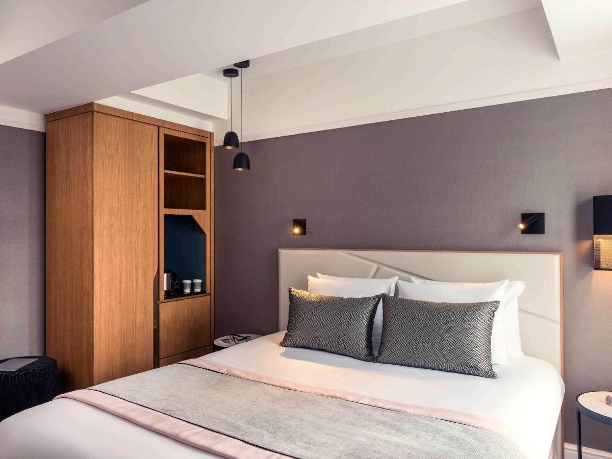 Un ou plusieurs lits dans un hébergement de l'établissement Mercure Paris Opera Garnier Hôtel & Spa