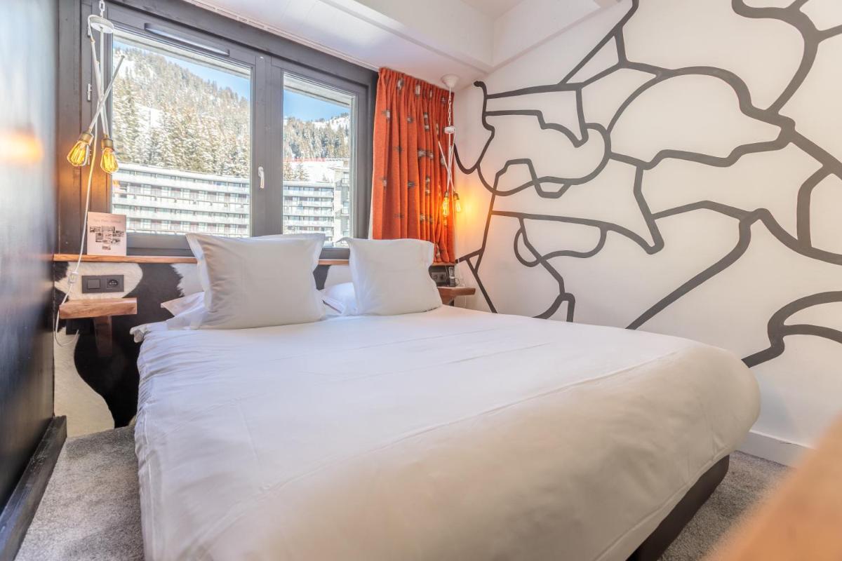 Un ou plusieurs lits dans un hébergement de l'établissement Totem, Friendly Hotel & Spa