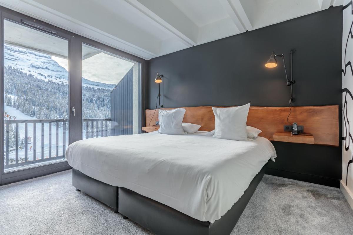 Un ou plusieurs lits dans un hébergement de l'établissement Totem, Friendly Hotel & Spa