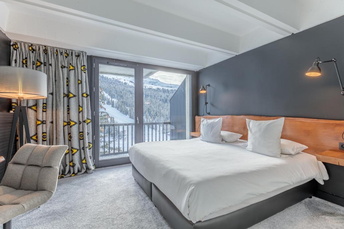 Un ou plusieurs lits dans un hébergement de l'établissement Totem, Friendly Hotel & Spa