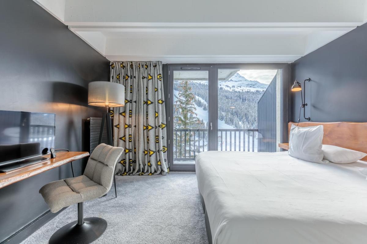 Un ou plusieurs lits dans un hébergement de l'établissement Totem, Friendly Hotel & Spa