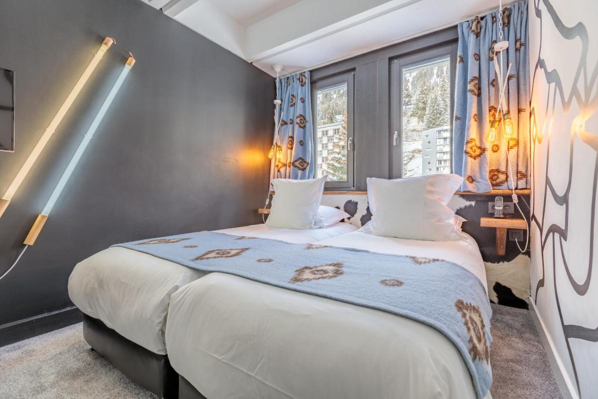 Un ou plusieurs lits dans un hébergement de l'établissement Totem, Friendly Hotel & Spa