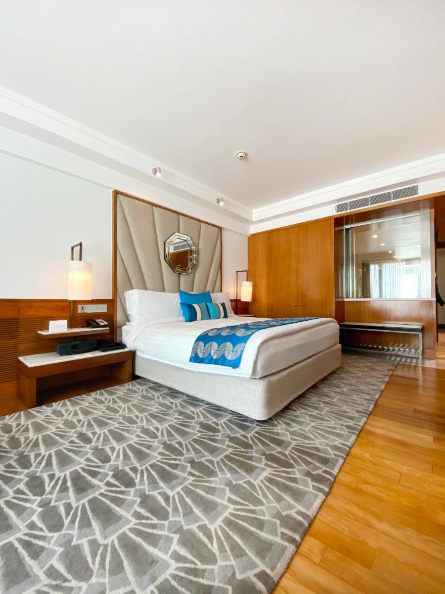 a bedroom with a large bed and a large rug at InterContinental Marine Drive Mumbai by IHG in Mumbai