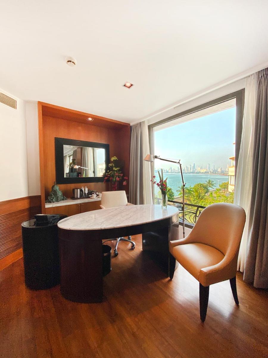 an office with a desk and a chair and a window at InterContinental Marine Drive Mumbai by IHG in Mumbai
