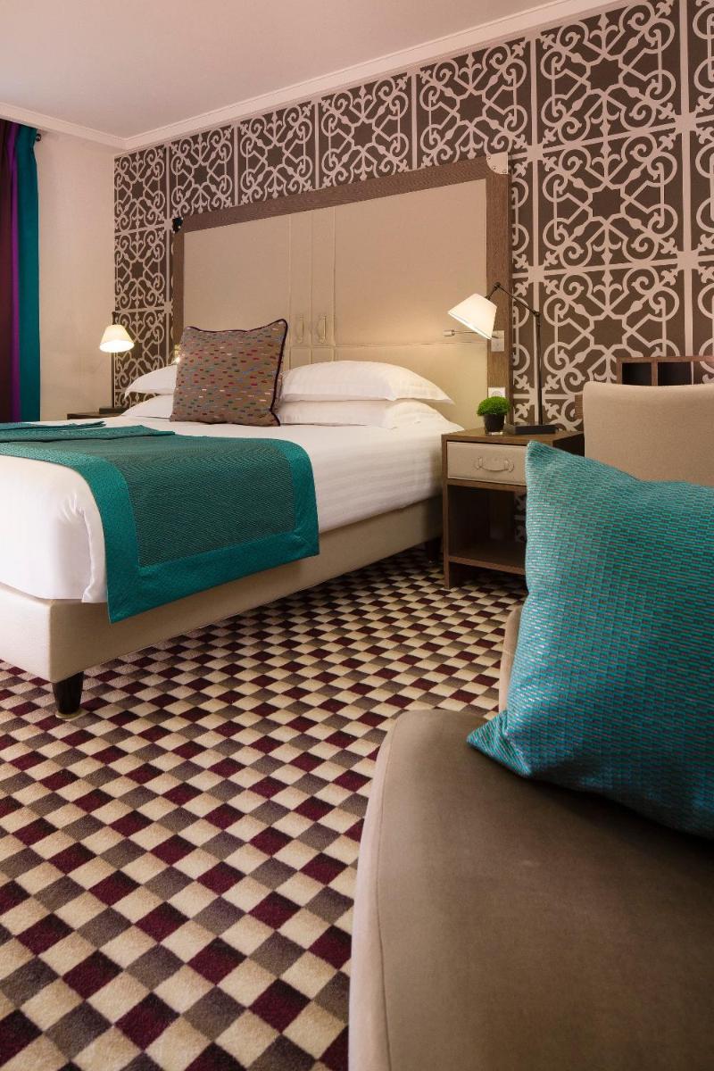 Un ou plusieurs lits dans un hébergement de l'établissement Hotel Phileas Lazare & Spa - Opera
