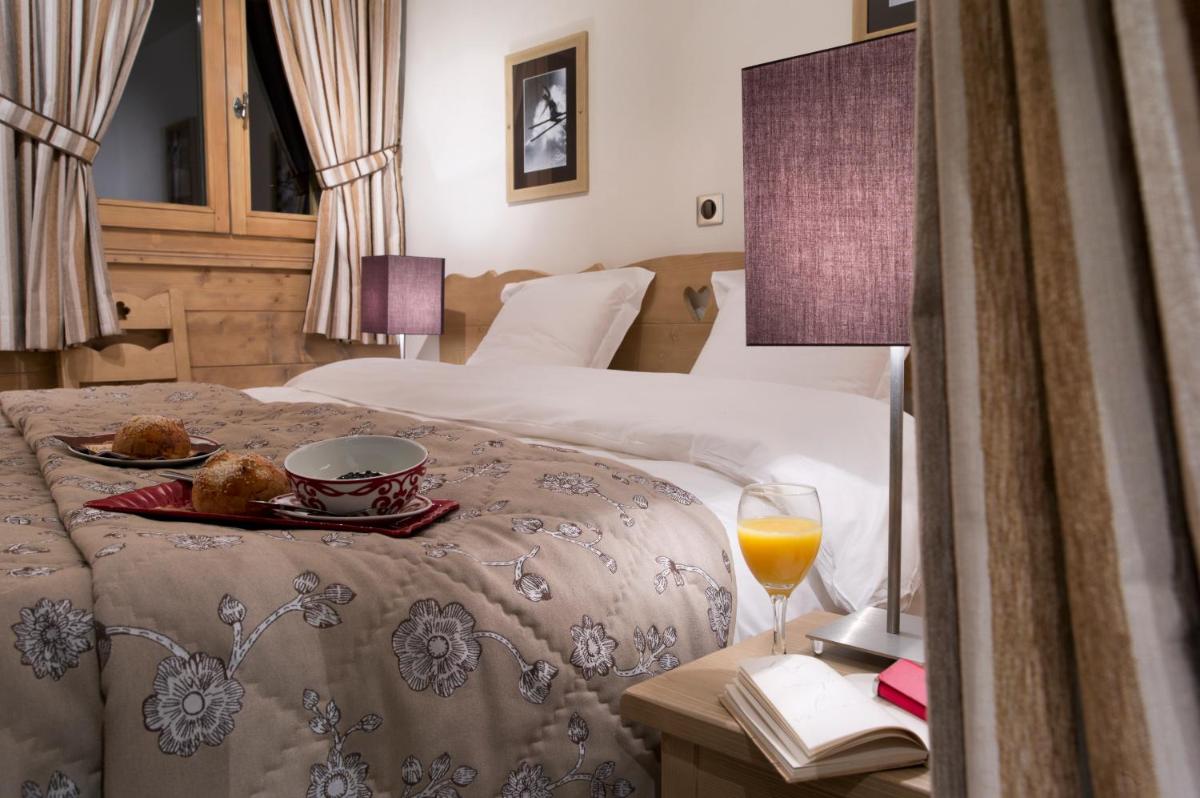 Un ou plusieurs lits dans un hébergement de l'établissement CGH Résidence Boutique Le Chalet des Dolines