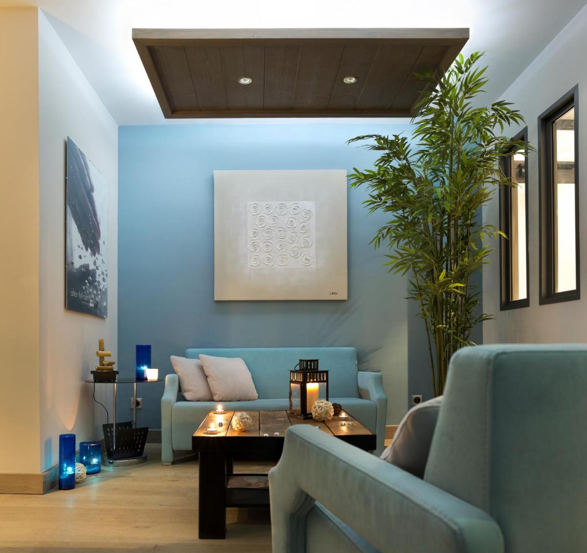 Coin salon dans l'établissement CGH Résidence Boutique Le Chalet des Dolines