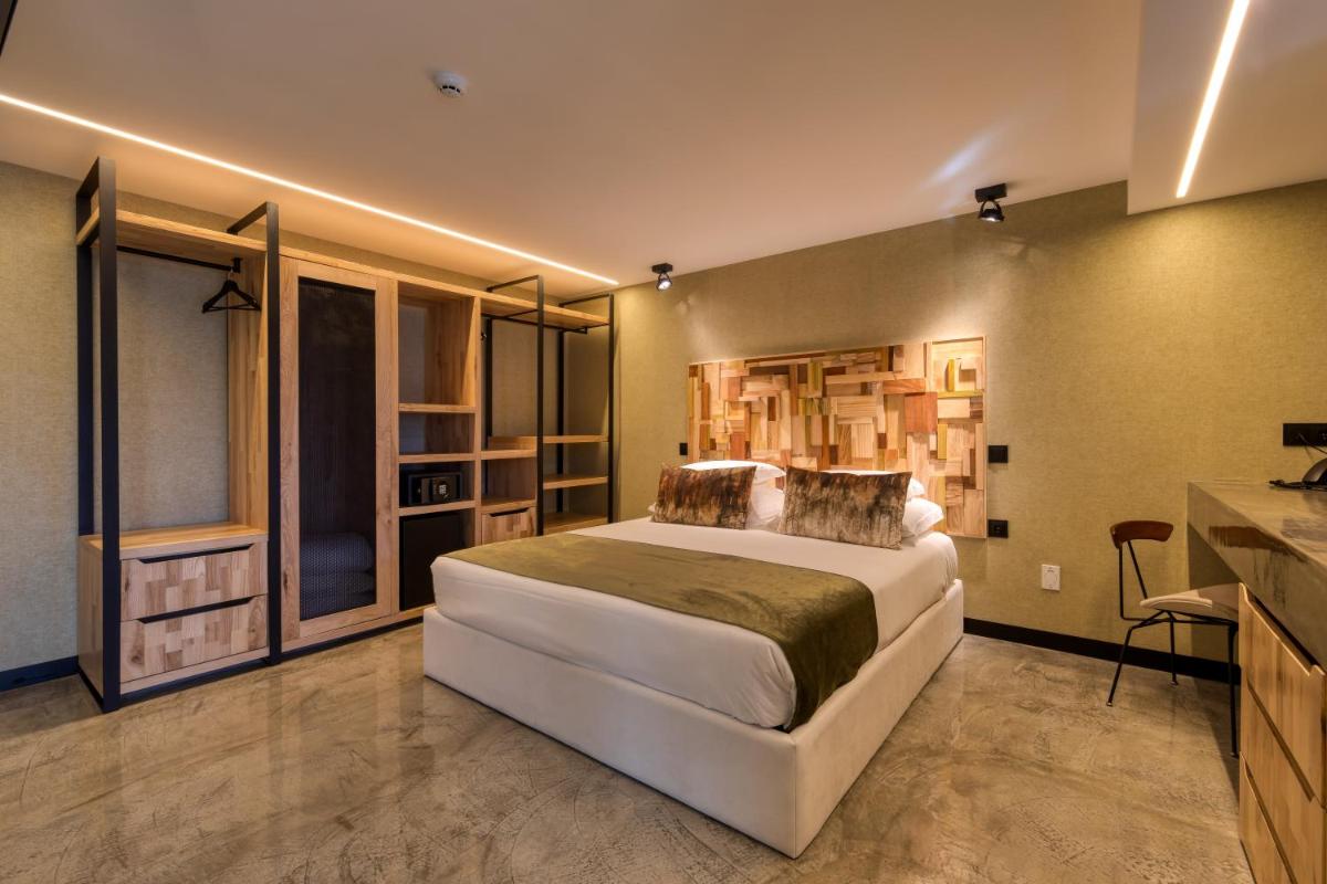 Uma cama ou camas num quarto em Well Hotel & Spa