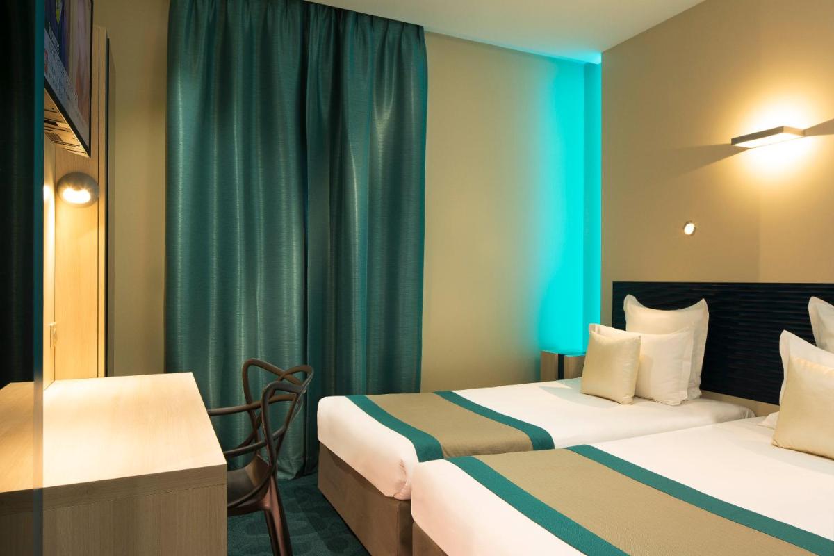 Un ou plusieurs lits dans un hébergement de l'établissement Hôtel Brésil Opéra SPA
