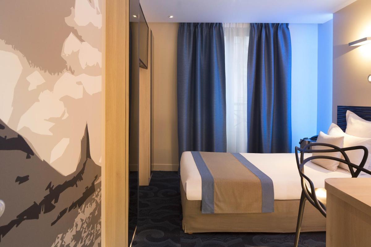 Un ou plusieurs lits dans un hébergement de l'établissement Hôtel Brésil Opéra SPA
