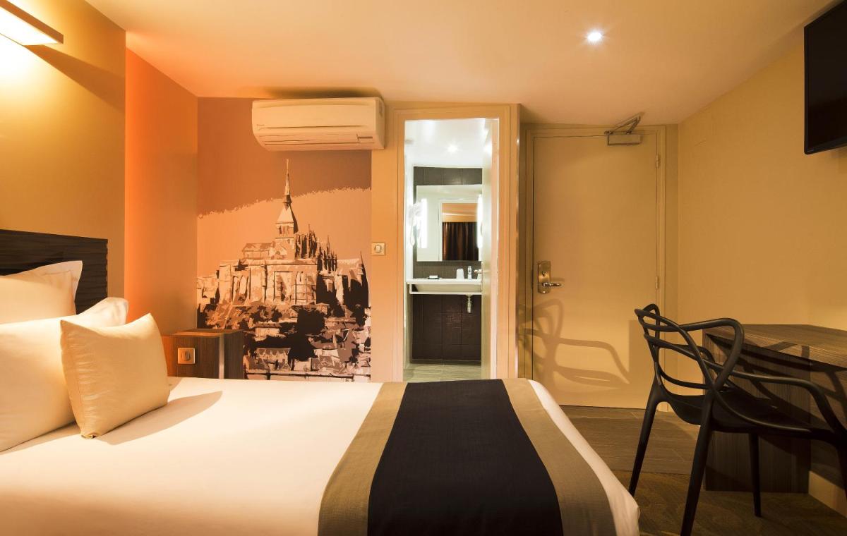Un ou plusieurs lits dans un hébergement de l'établissement Hôtel Brésil Opéra SPA
