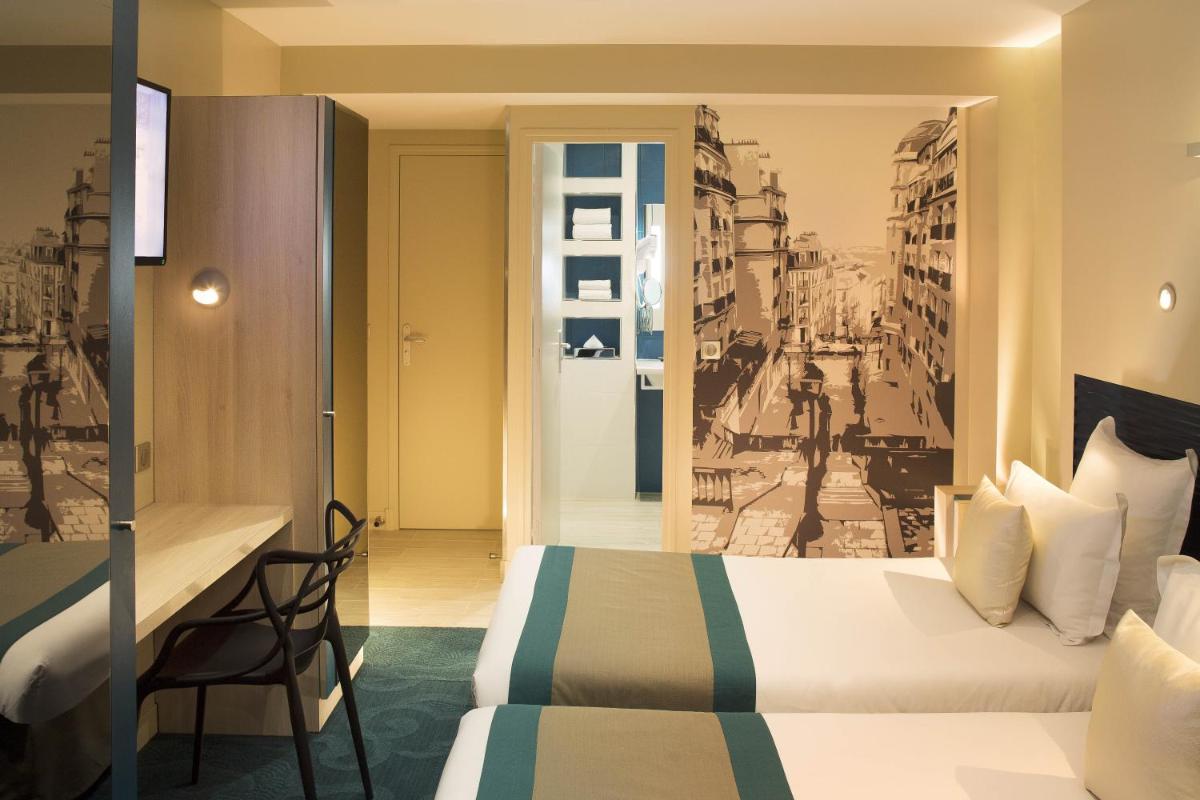 Un ou plusieurs lits dans un hébergement de l'établissement Hôtel Brésil Opéra SPA