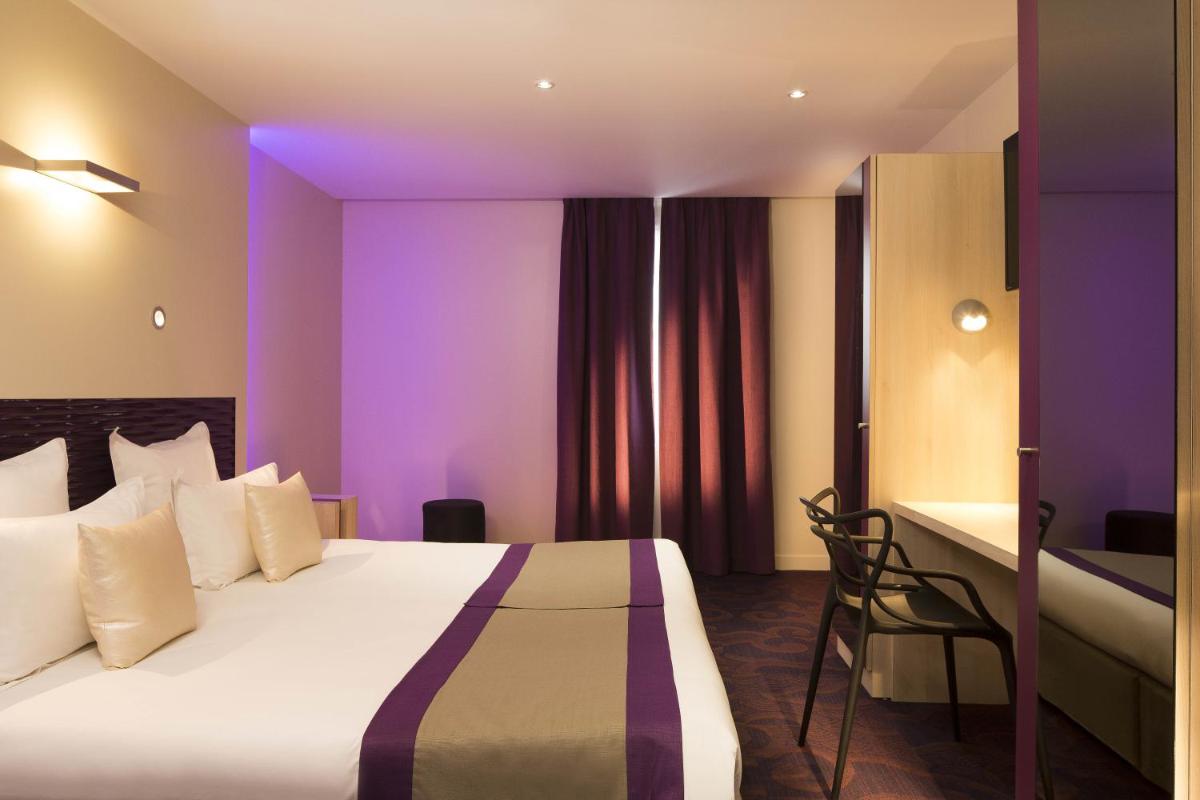 Un ou plusieurs lits dans un hébergement de l'établissement Hôtel Brésil Opéra SPA