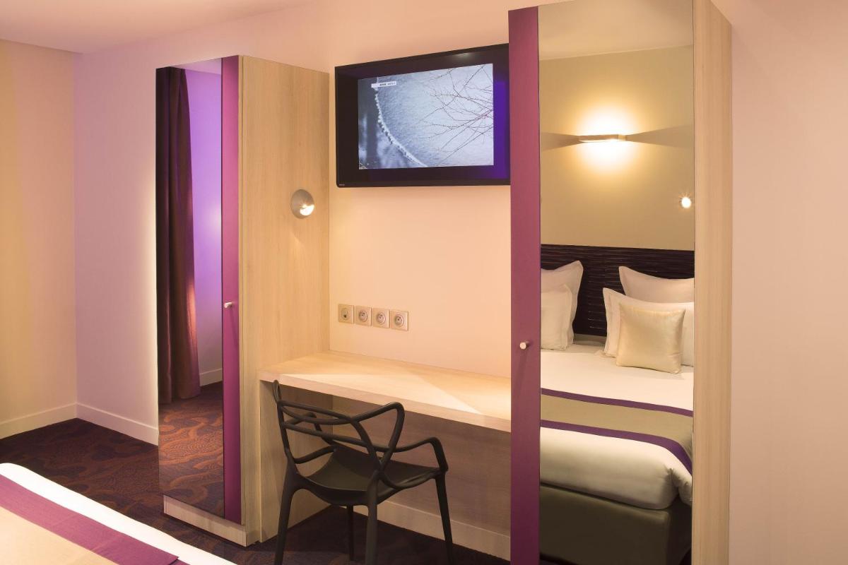 Un ou plusieurs lits dans un hébergement de l'établissement Hôtel Brésil Opéra SPA