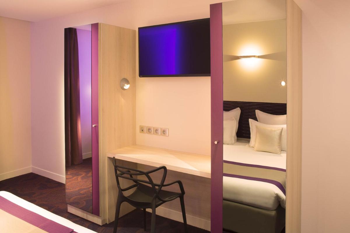Un ou plusieurs lits dans un hébergement de l'établissement Hôtel Brésil Opéra SPA