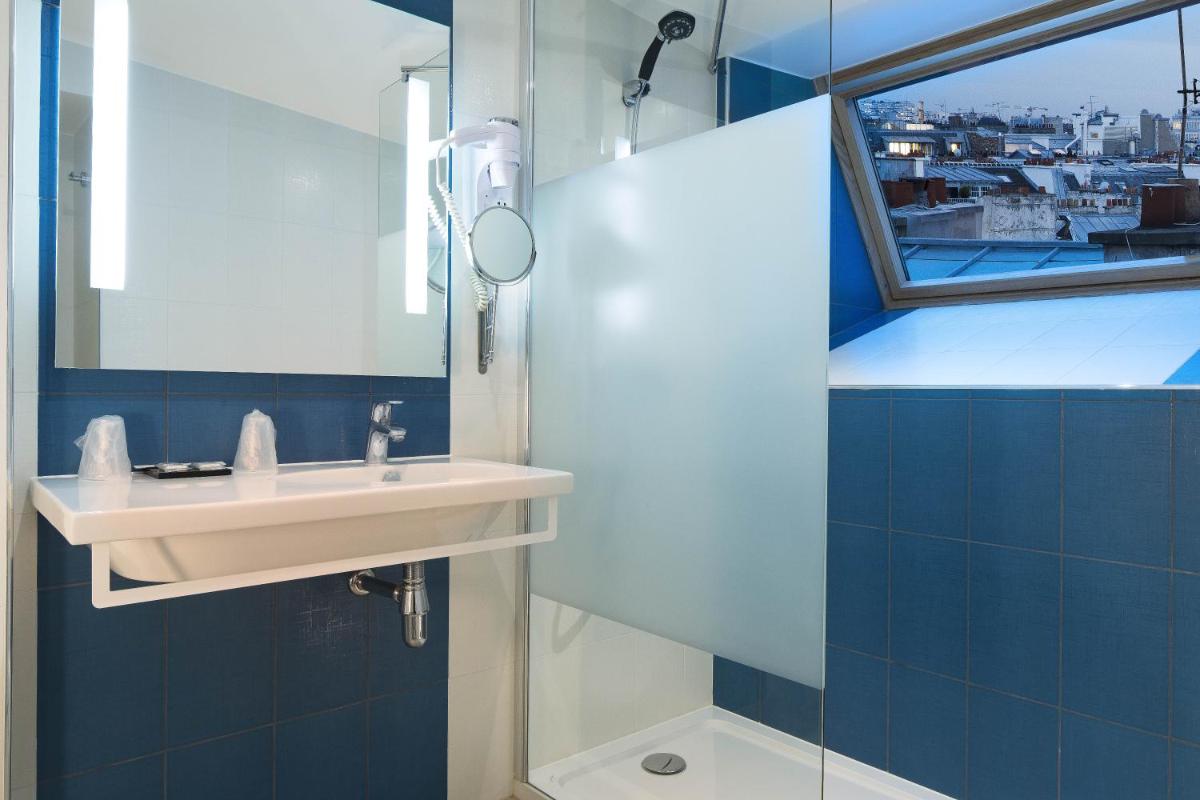Salle de bains dans l'établissement Hôtel Brésil Opéra SPA