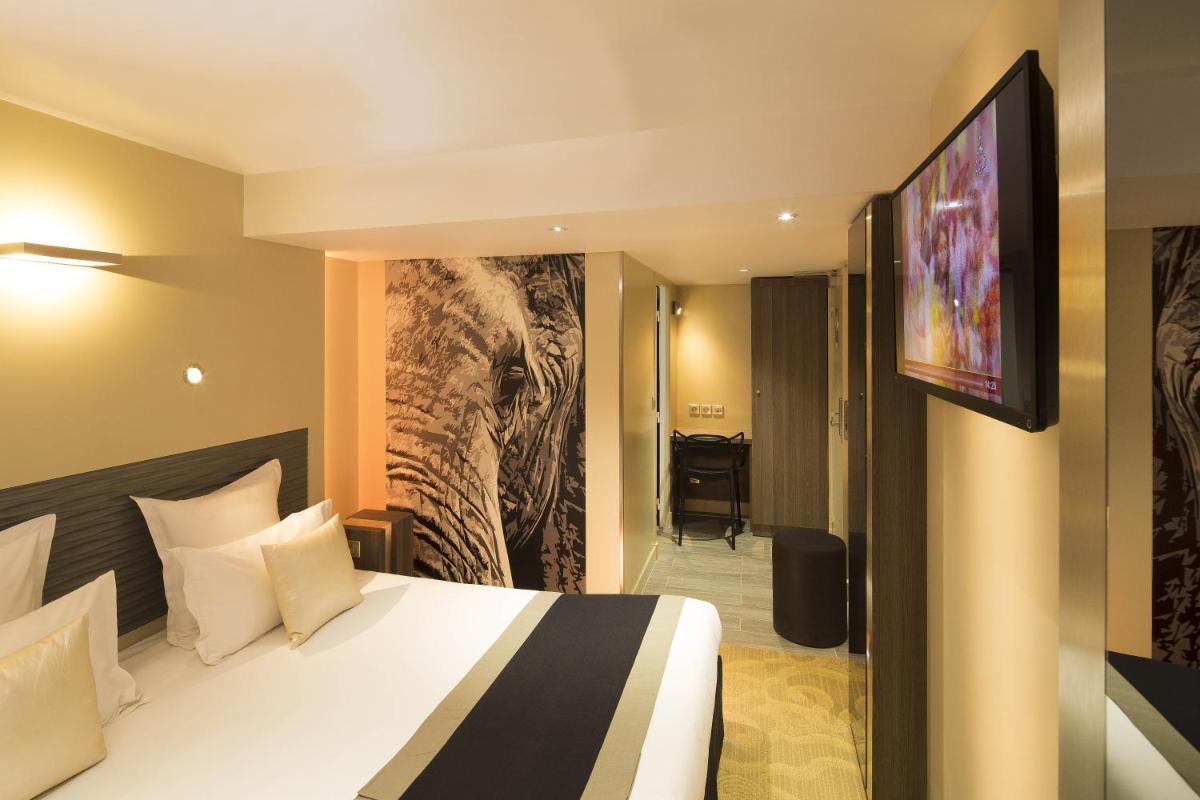 Un ou plusieurs lits dans un hébergement de l'établissement Hôtel Brésil Opéra SPA