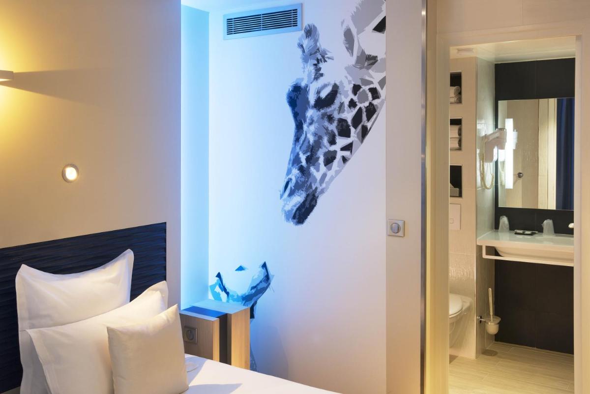 Un ou plusieurs lits dans un hébergement de l'établissement Hôtel Brésil Opéra SPA