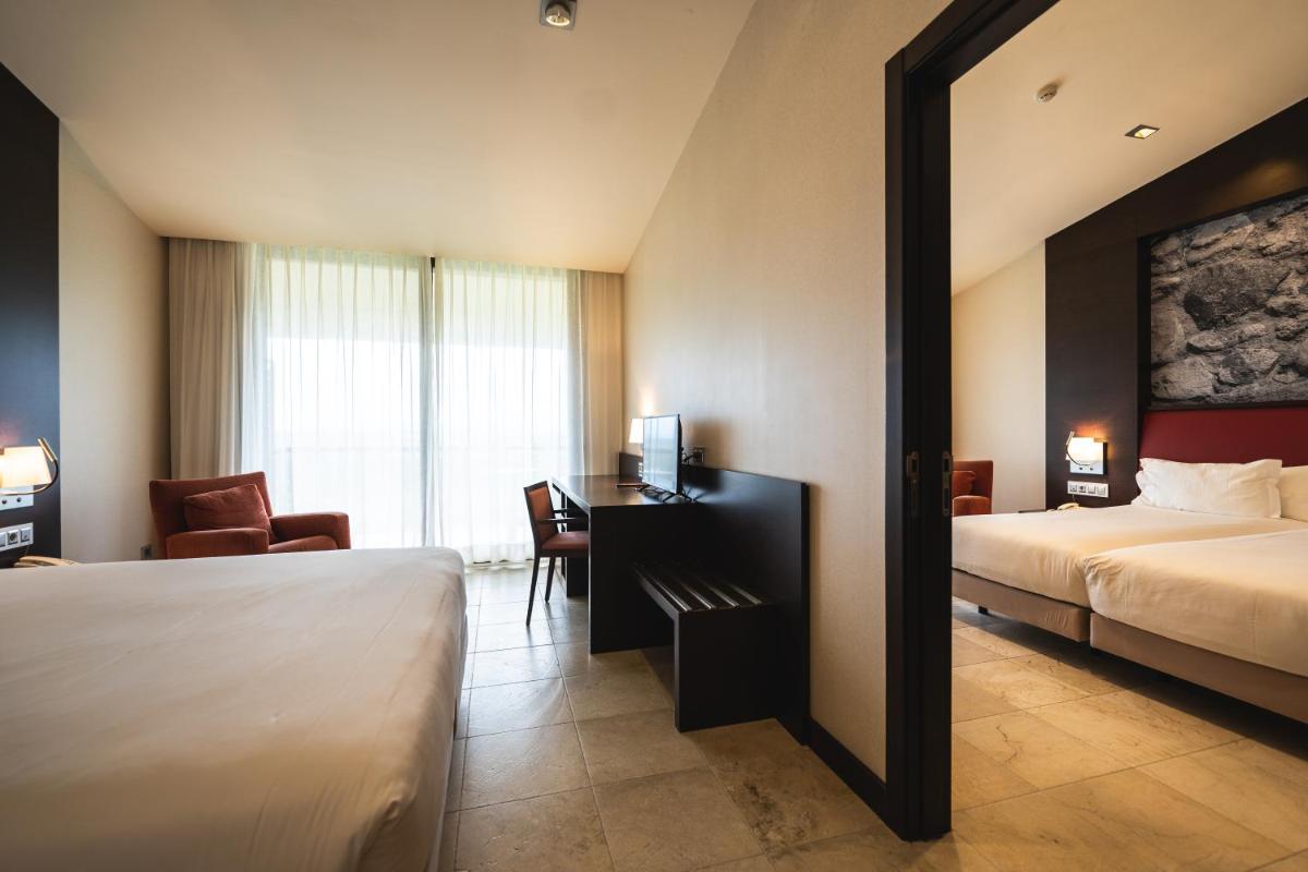 Cama o camas de una habitación en Hotel Mas Solà