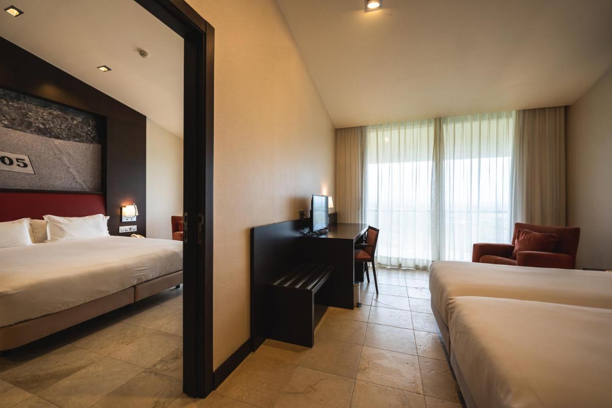 Cama o camas de una habitación en Hotel Mas Solà