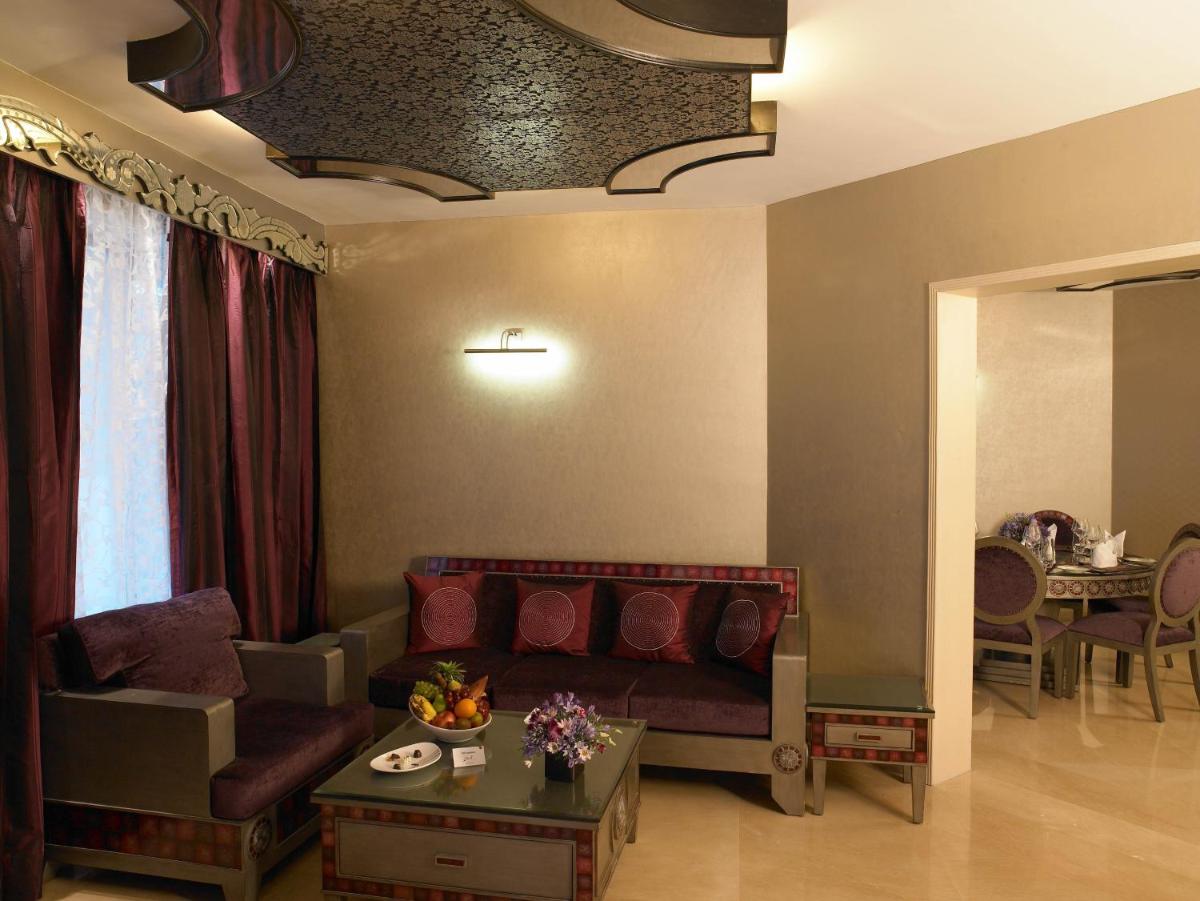 a living room with a couch and a table at The Zuri Whitefield Bengaluru in Bengaluru