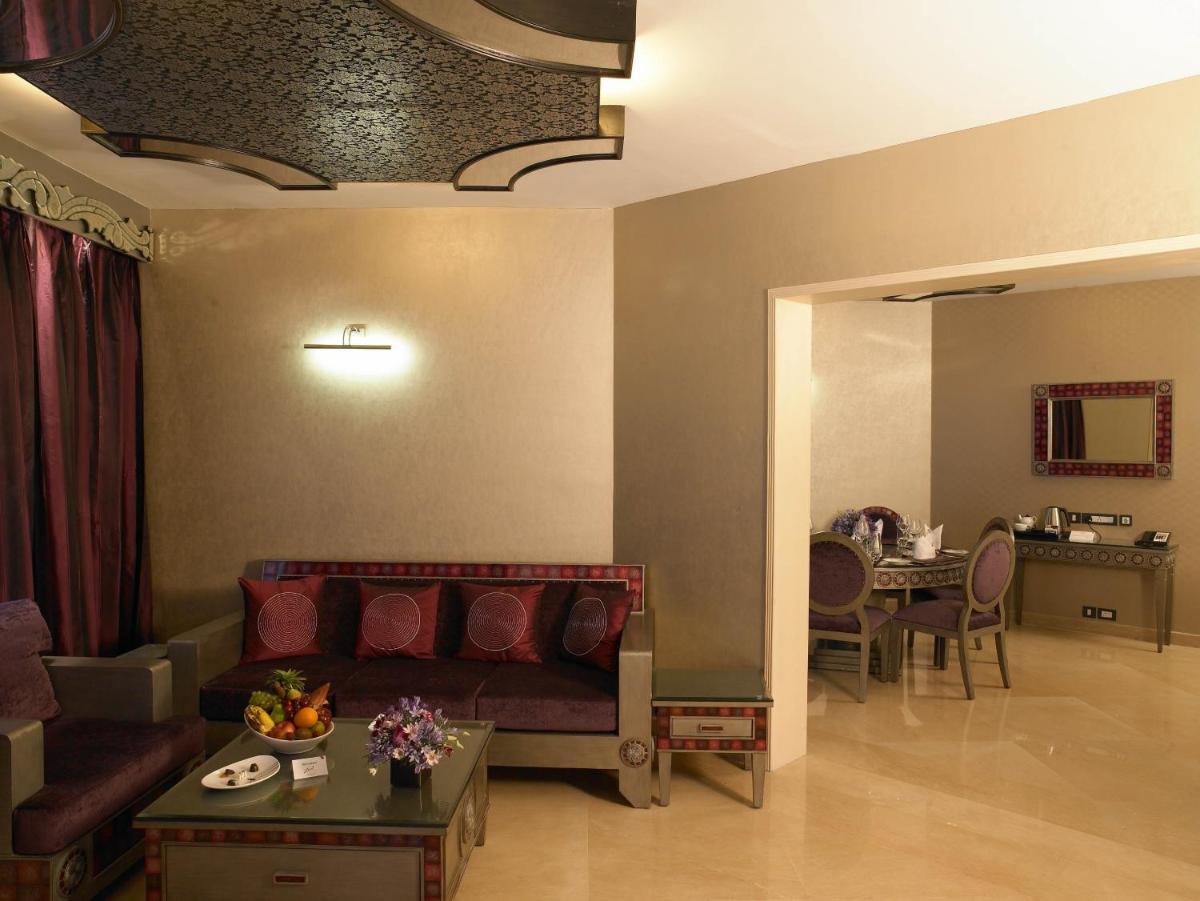 a living room with a couch and a table at The Zuri Whitefield Bengaluru in Bengaluru