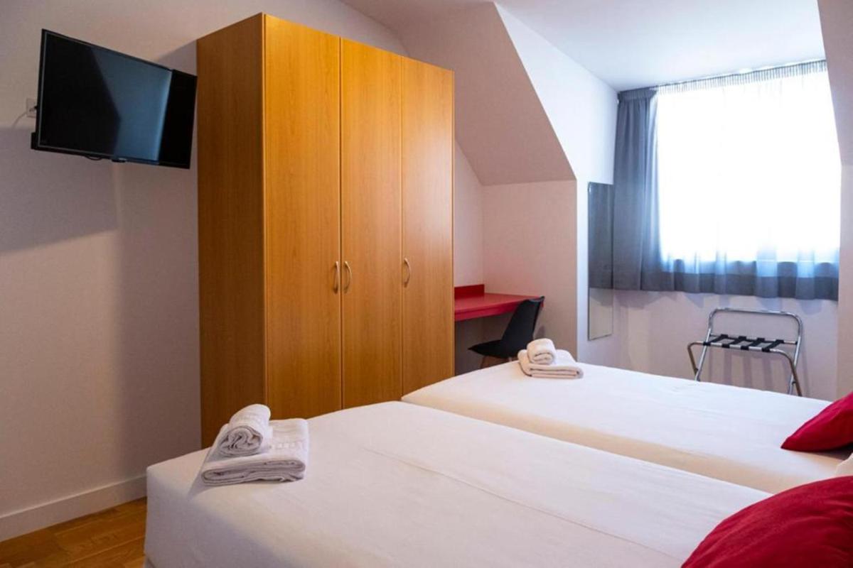 Cama o camas de una habitación en Hotel Spa Odeón