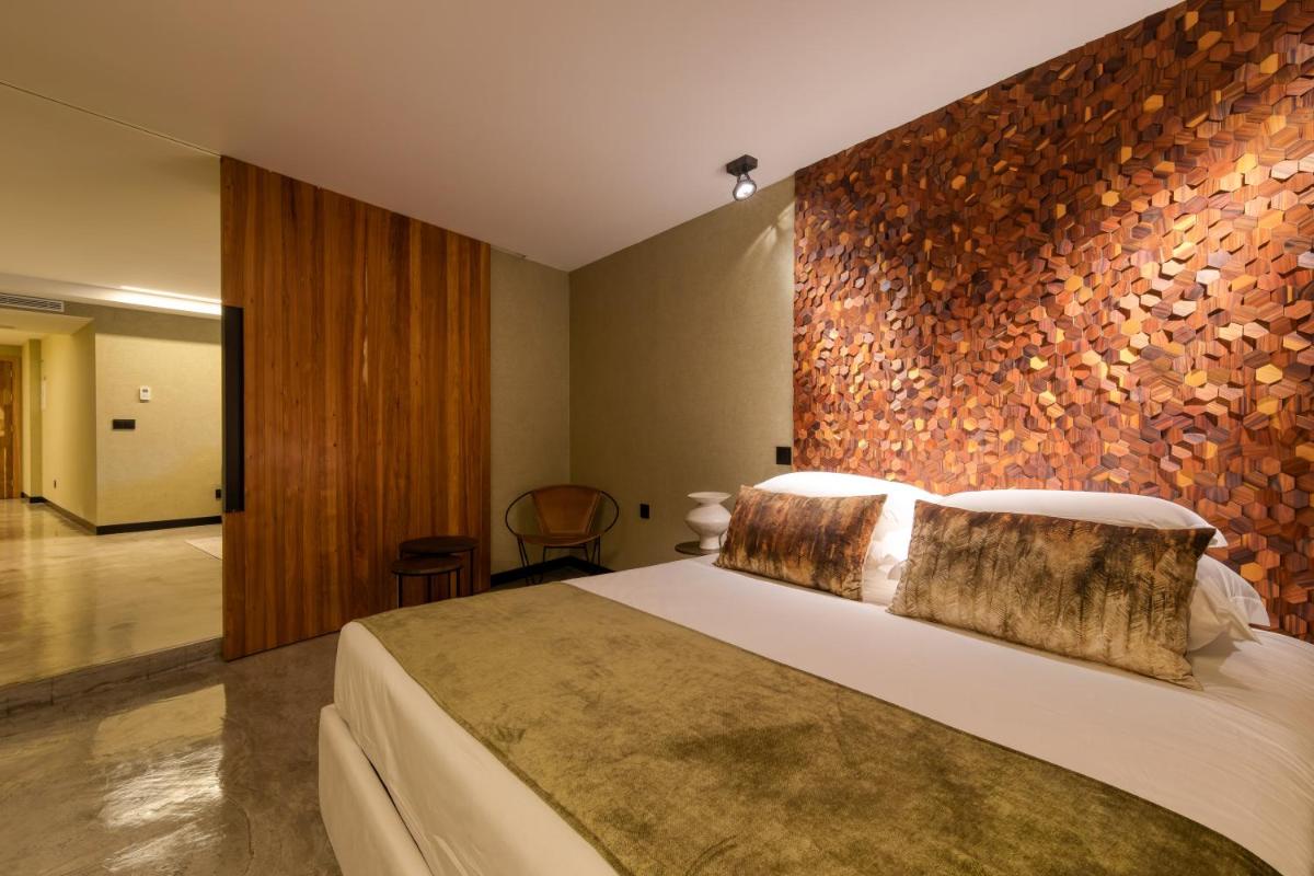 Uma cama ou camas num quarto em Well Hotel & Spa