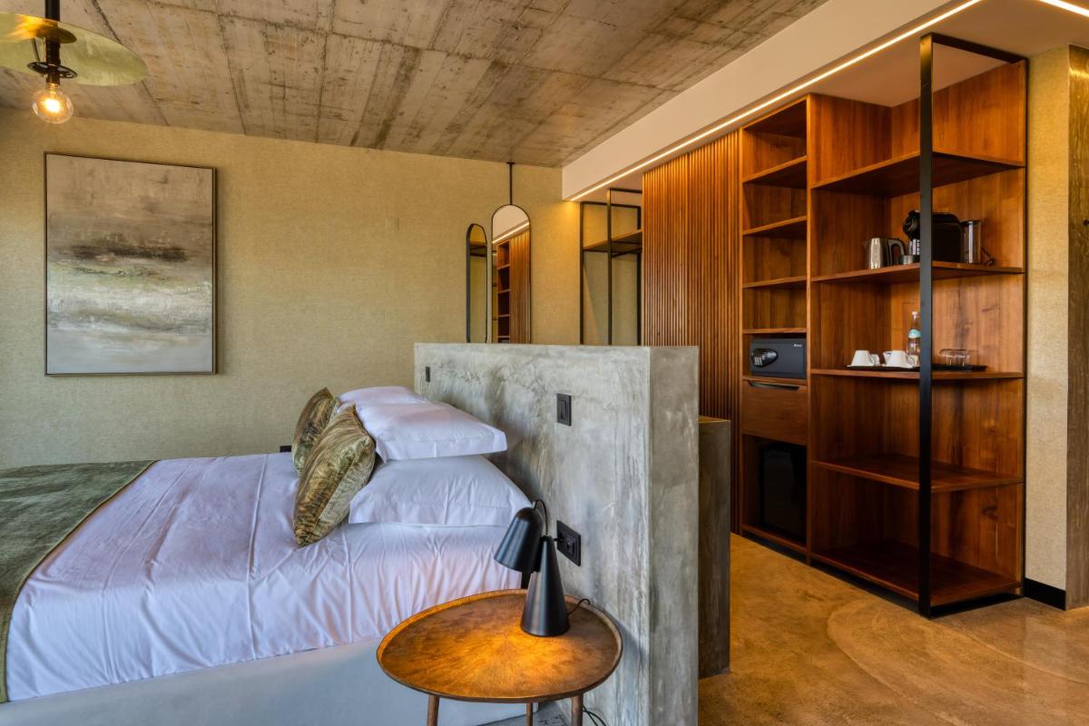 Uma cama ou camas num quarto em Well Hotel & Spa