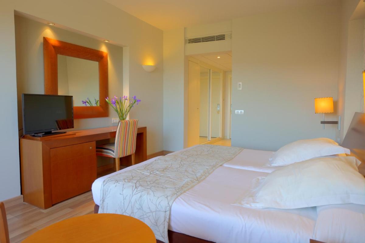 Cama o camas de una habitación en Hotel Valle del Este