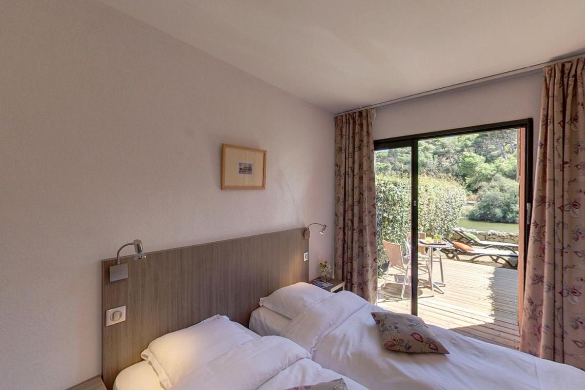 Un ou plusieurs lits dans un hébergement de l'établissement Hotel Le Phoebus Garden & Spa