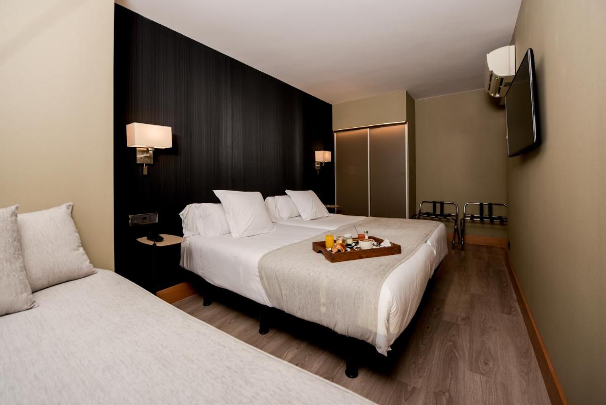 Cama o camas de una habitación en Hotel Plaza