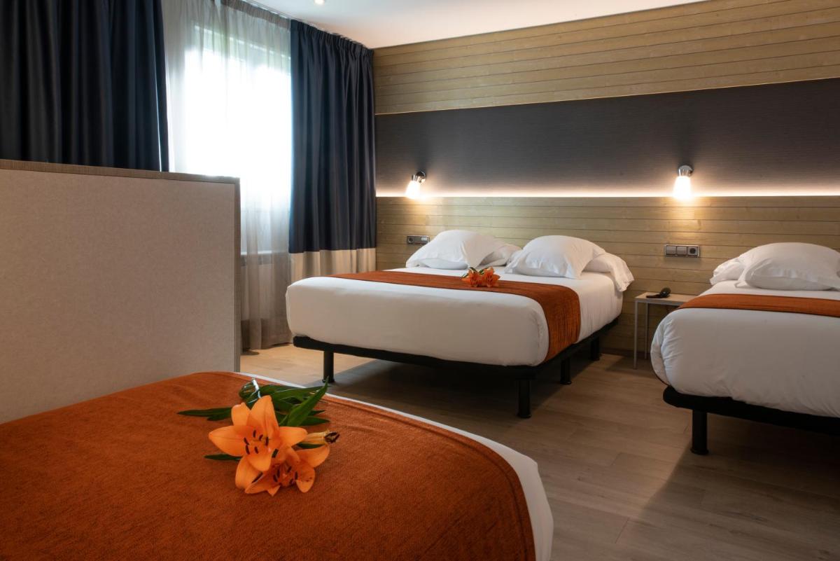Cama o camas de una habitación en Hotel Avenida