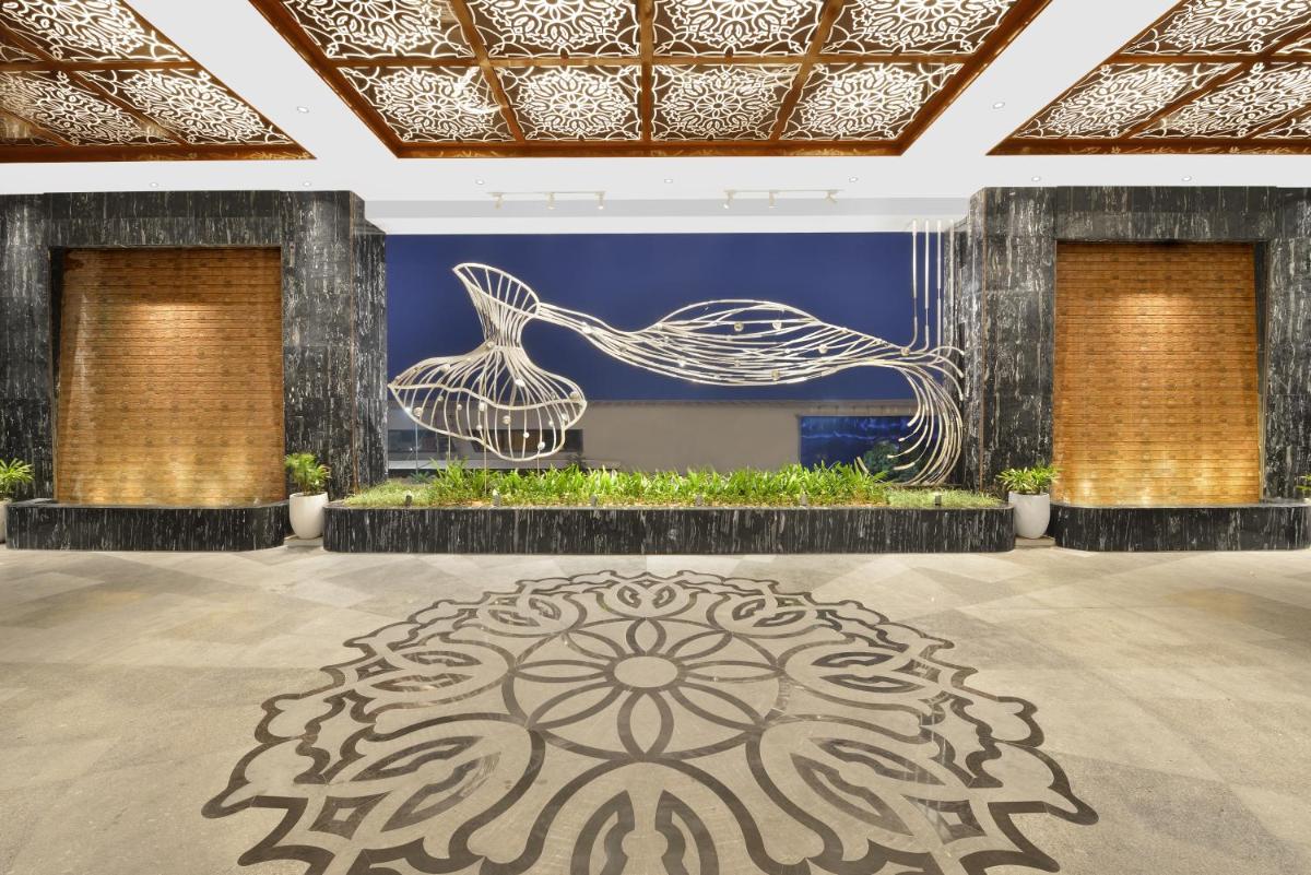a room with a large rug on the floor at Taj Skyline Ahmedabad in Ahmedabad