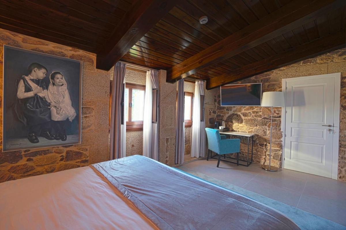 Cama o camas de una habitación en Hotel As Torres da Hermida
