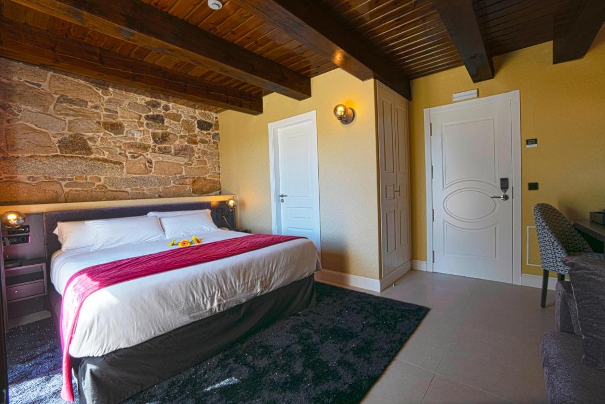 Cama o camas de una habitación en Hotel As Torres da Hermida