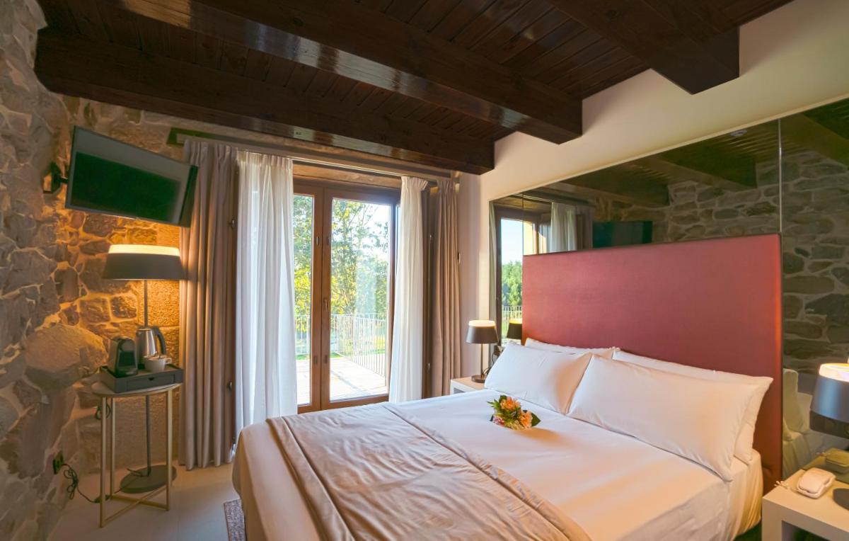 Cama o camas de una habitación en Hotel As Torres da Hermida