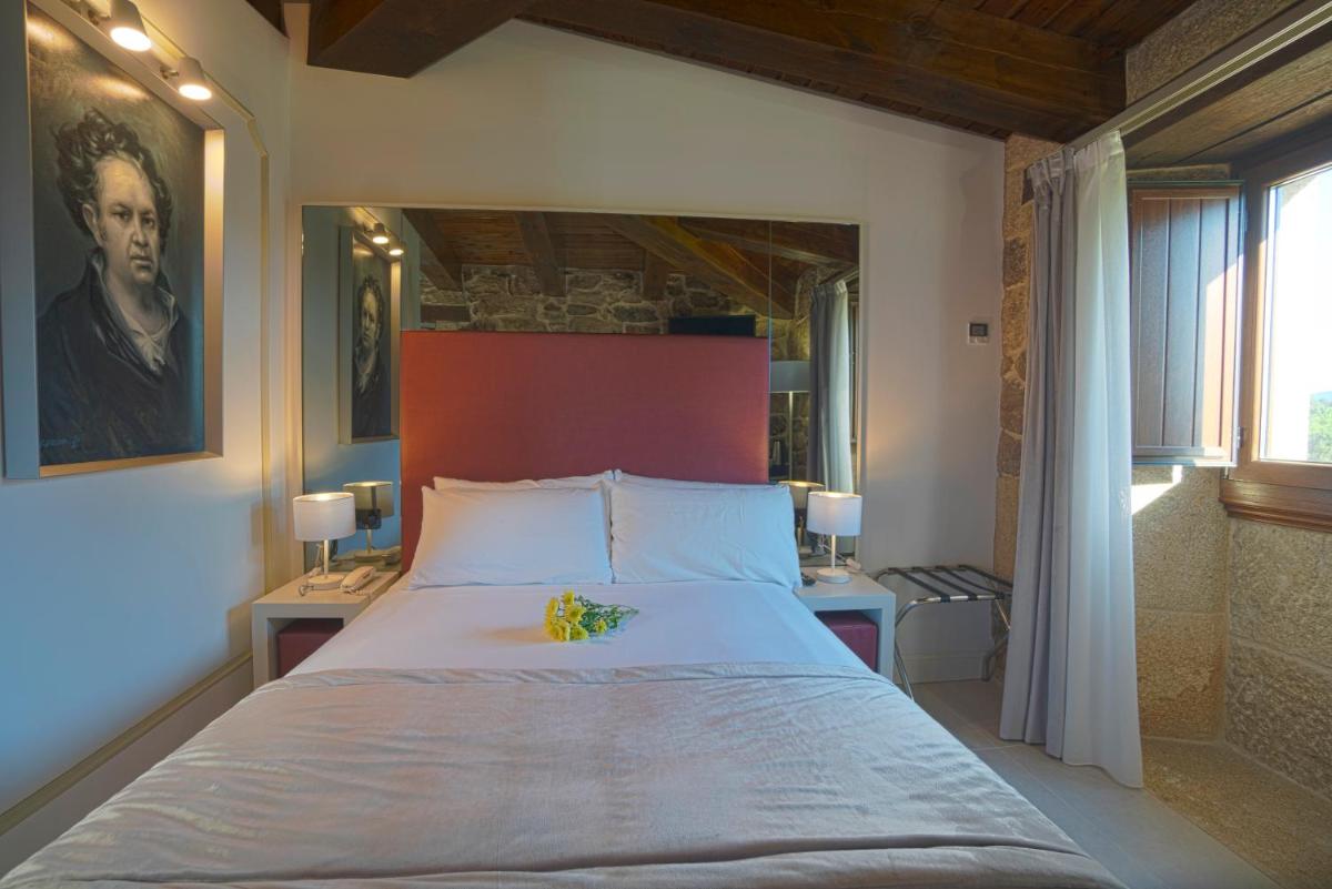 Cama o camas de una habitación en Hotel As Torres da Hermida