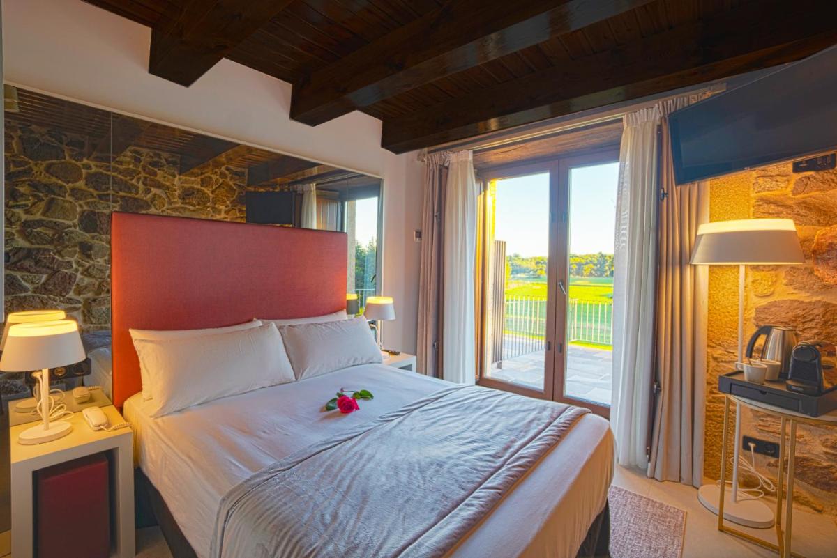 Cama o camas de una habitación en Hotel As Torres da Hermida