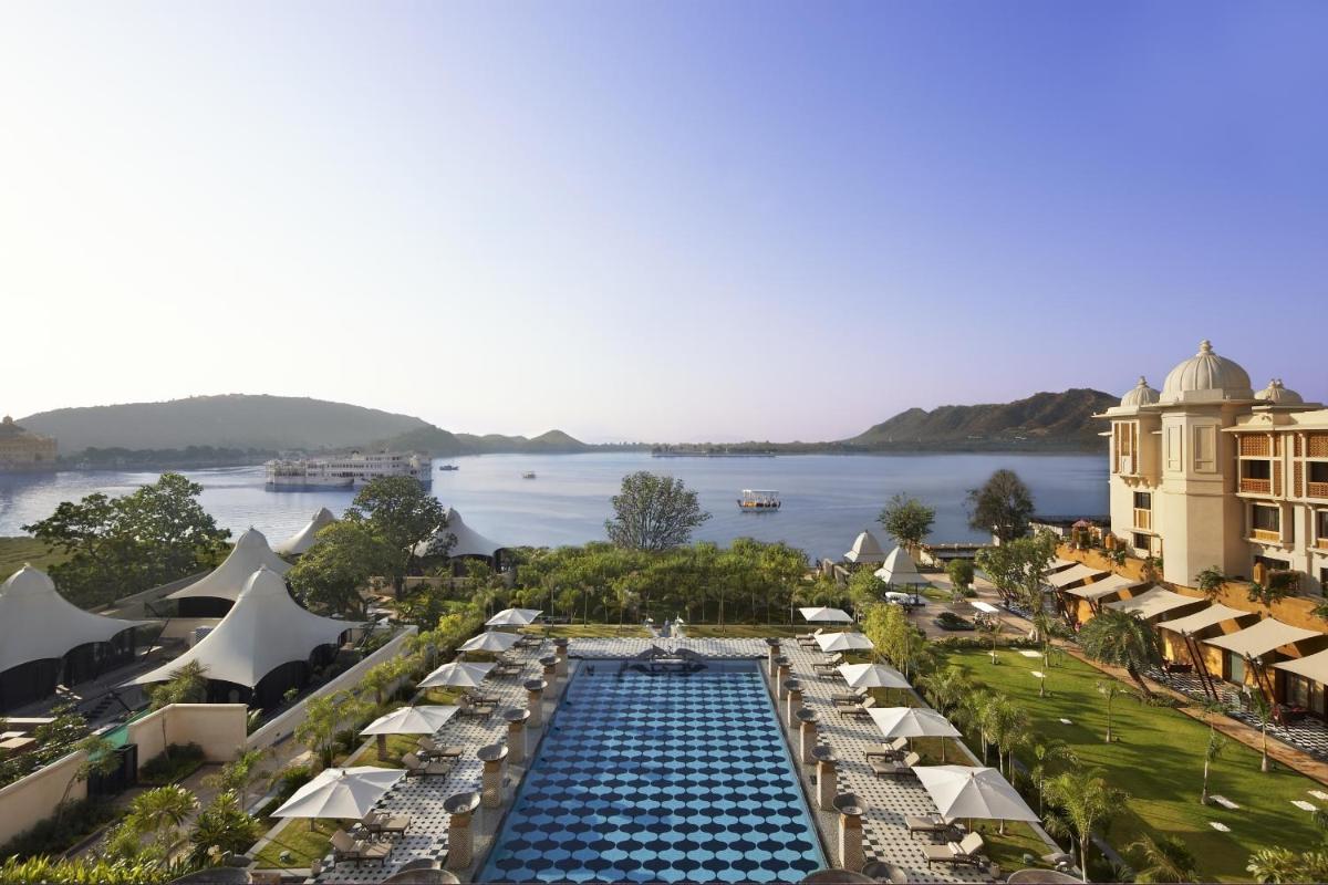 an aerial view of a resort with a swimming pool at The Leela Palace Udaipur in Udaipur